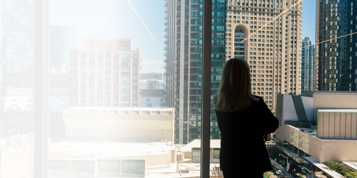 woman looking out window